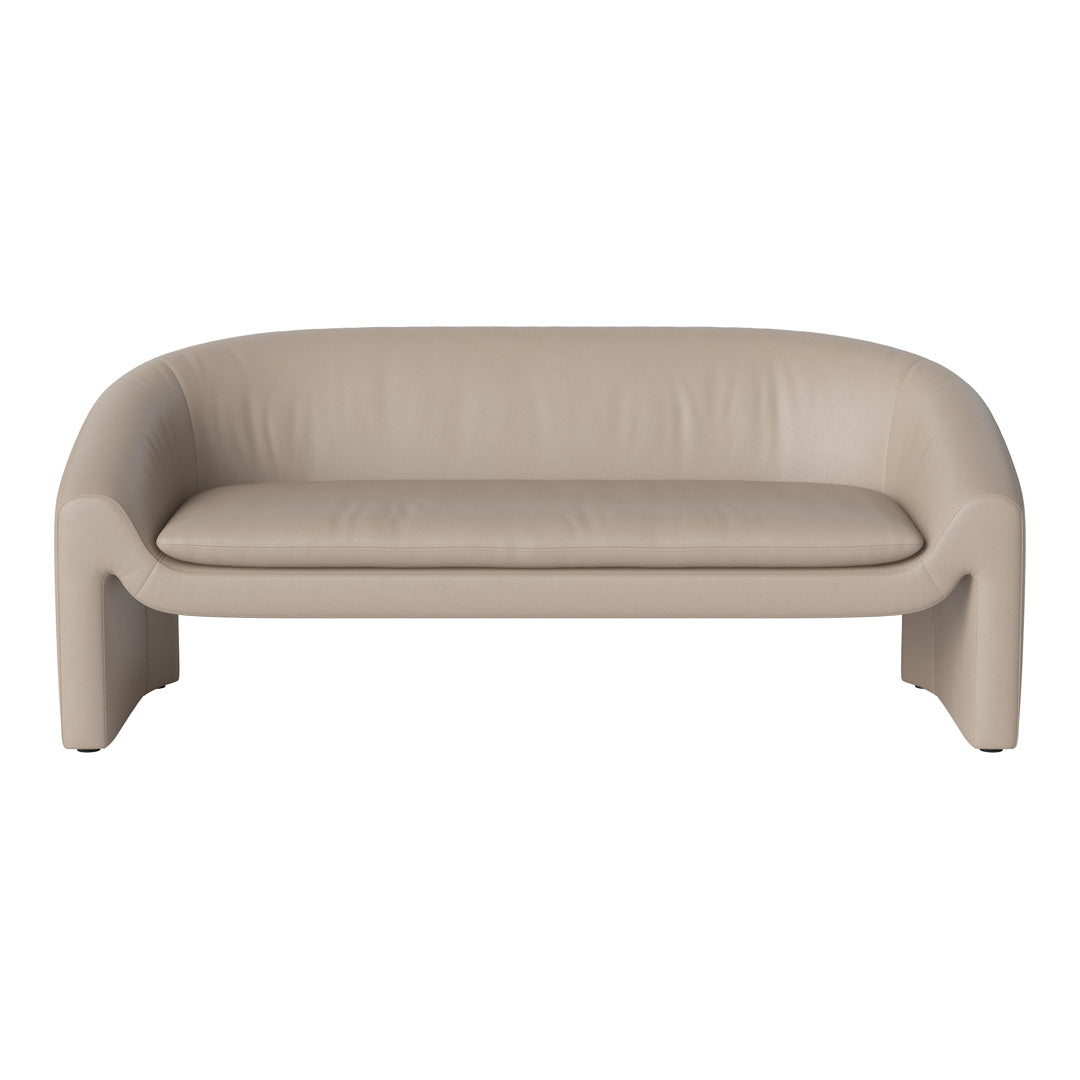 Sleek beige leather sofa with smooth, minimalist design and gentle curves, perfect for modern interiors.