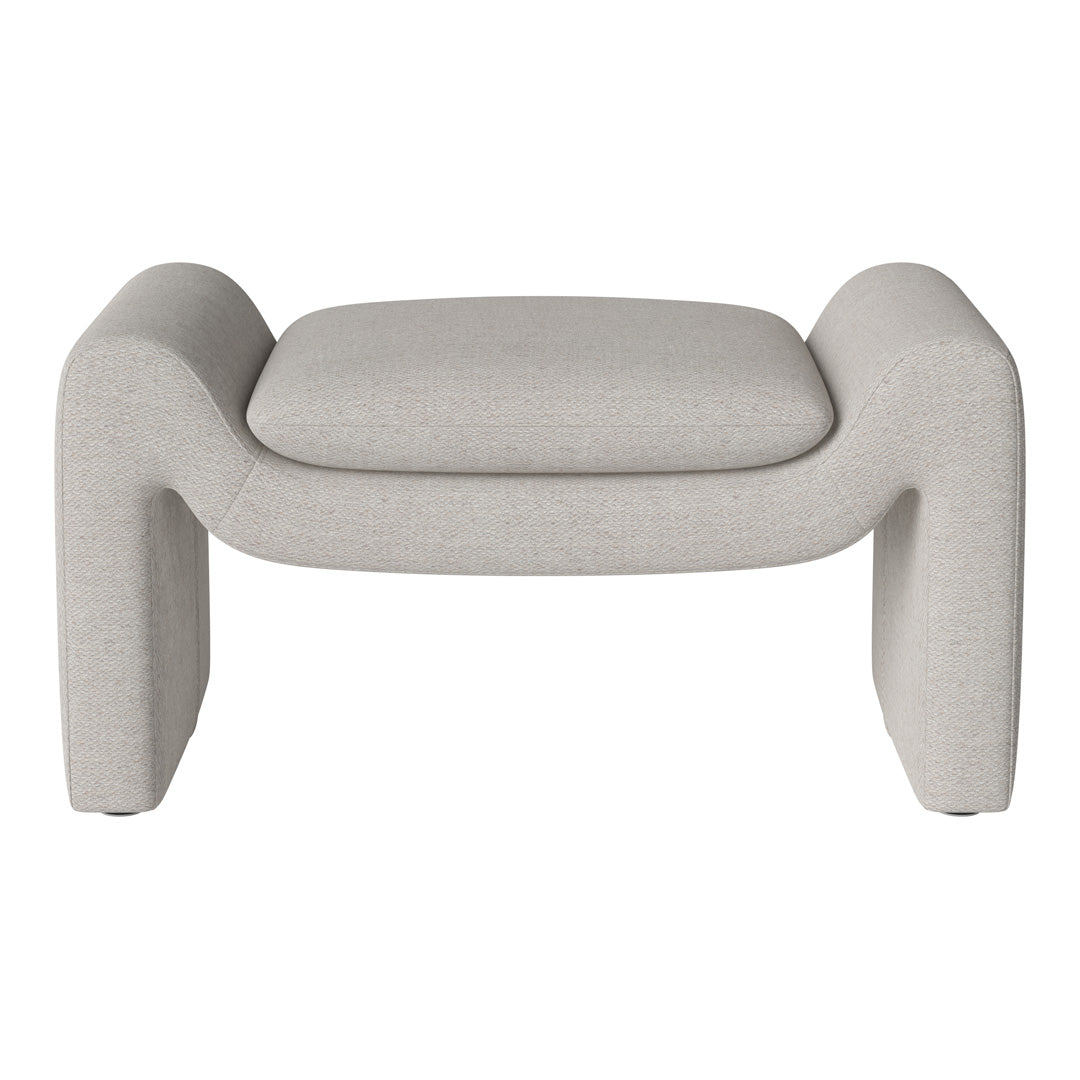 Light gray upholstered ottoman with a textured, soft finish and rounded edges, perfect for modern interiors.