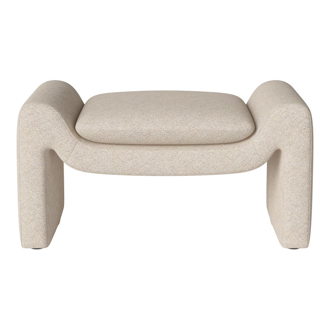 Beige upholstered ottoman with a soft, textured finish and contemporary rounded edges. Ideal for modern interiors.