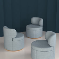 Light blue upholstered chairs with rounded backs and wooden bases, set against a dark teal background.