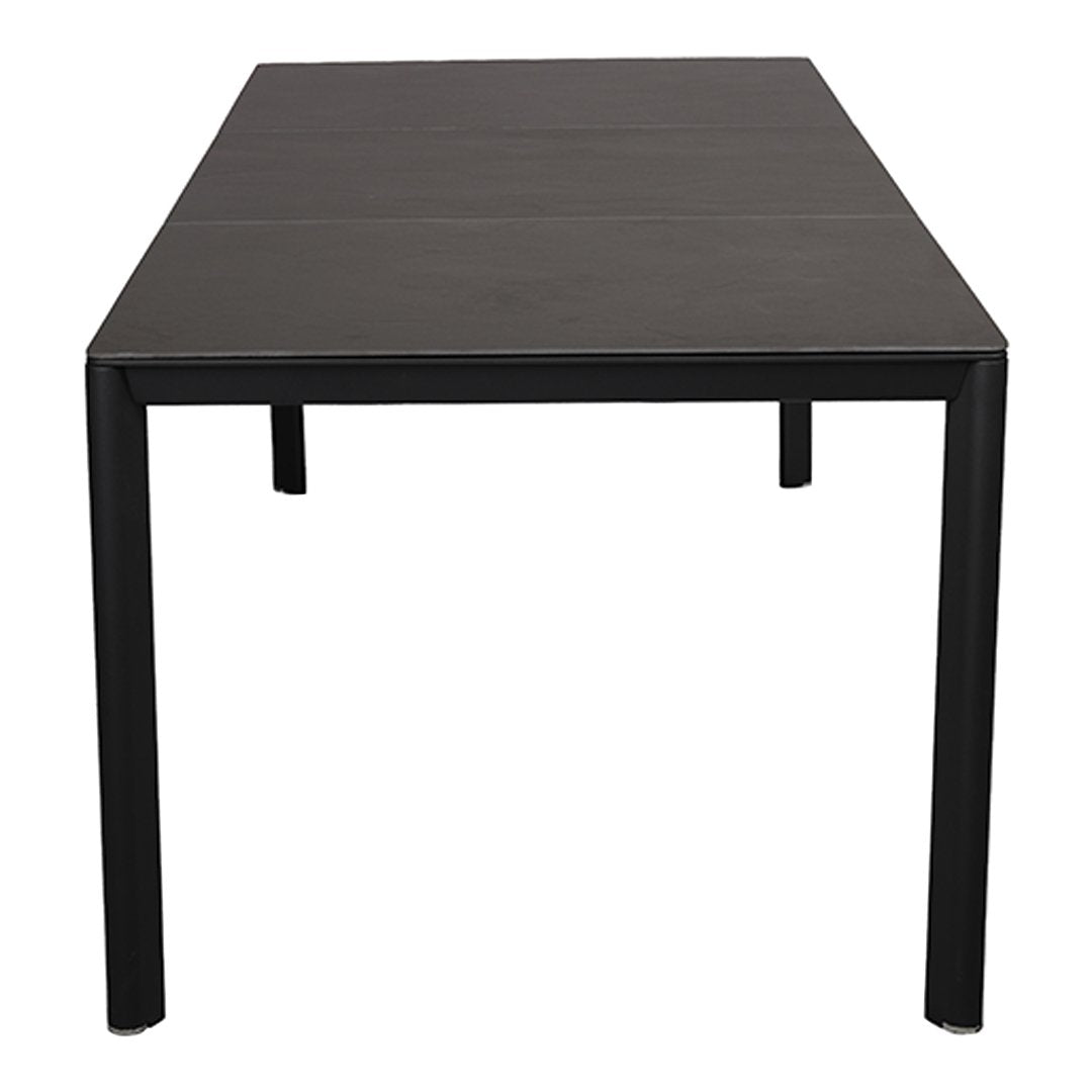 Sleek black rectangular dining table with a smooth surface and minimalistic design. Ideal for modern decor.