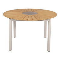 Round wooden dining table with a natural wood finish and sleek white metal legs, featuring a central circular pattern.