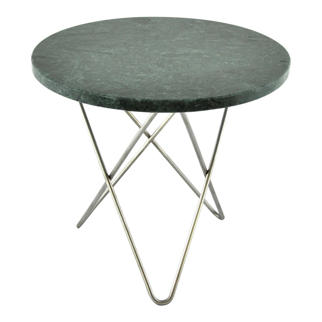 Round green marble tabletop with smooth surface, supported by sleek silver metal legs in a geometric design.