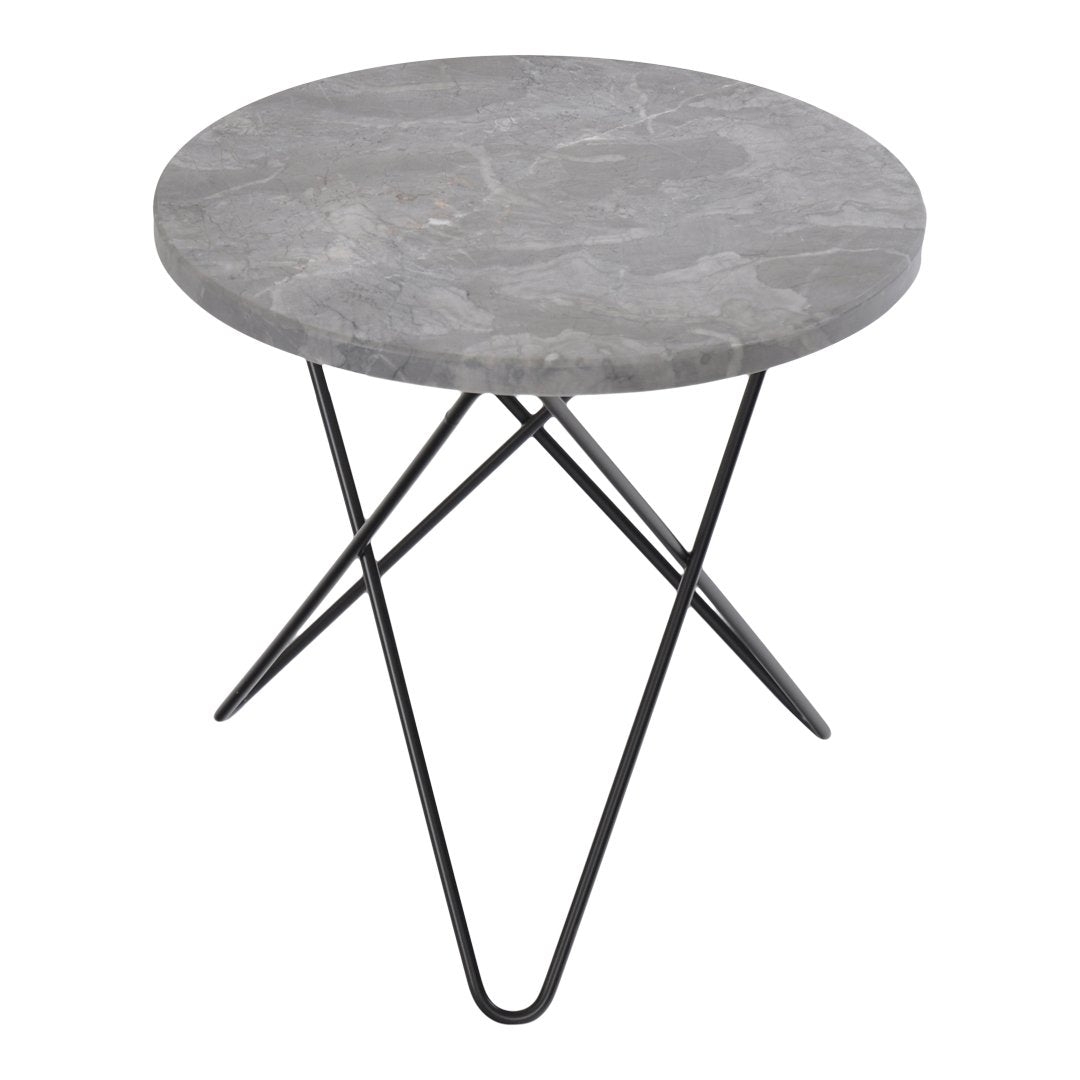 Round gray marble table with a smooth surface and black metal tripod legs, featuring a modern minimalist design.