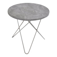 Round gray marble side table with sleek silver metal legs, featuring a smooth, minimalist design.