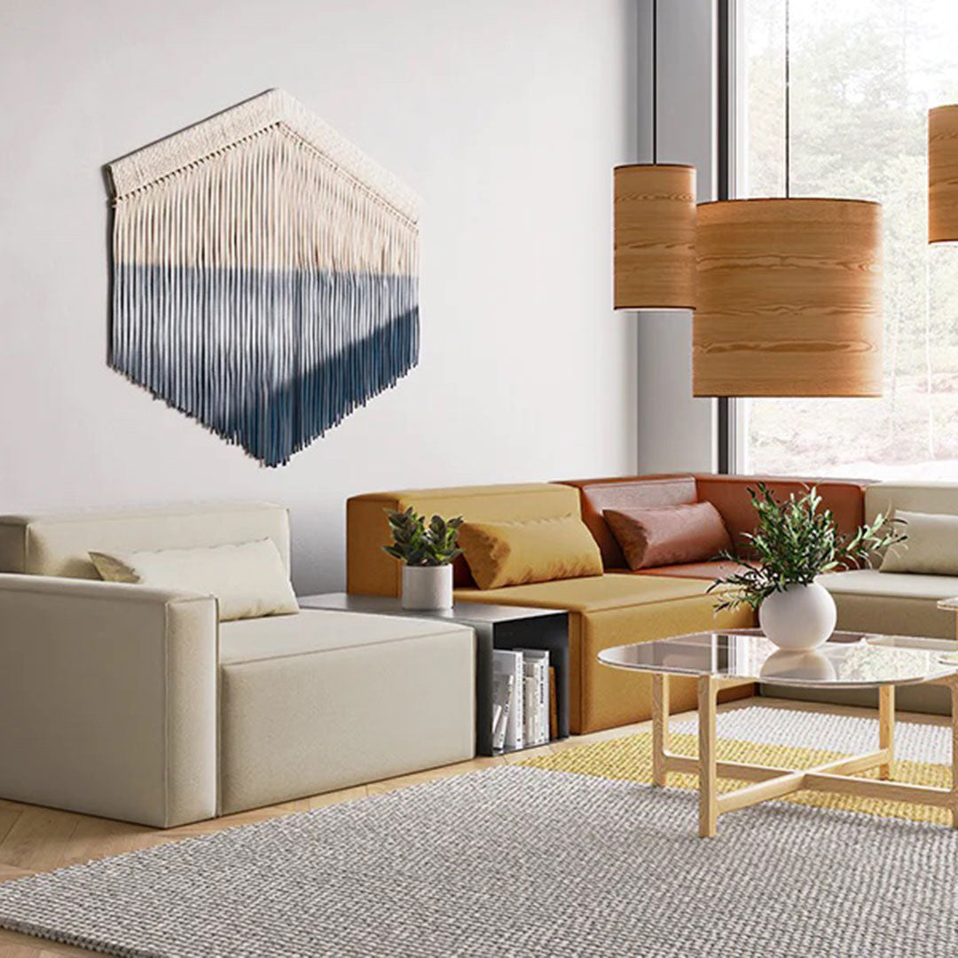 Textured wall art in beige, cream, and blue ombre design, enhancing modern living room decor.