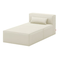 Cream-colored minimalist bed with a smooth, solid pattern and matching small pillow. Perfect for modern decor.