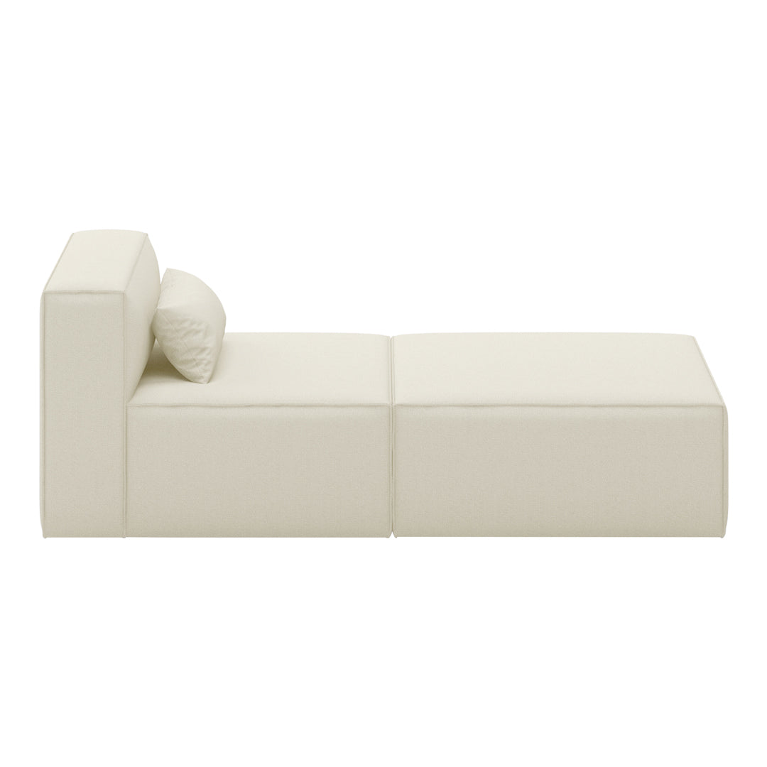 Sleek cream leather chaise lounge with a minimalist design and a matching round pillow. Perfect for modern decor.