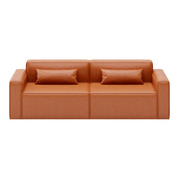 Rust orange modern sofa with smooth texture and two matching throw pillows. Minimalist design with clean lines.