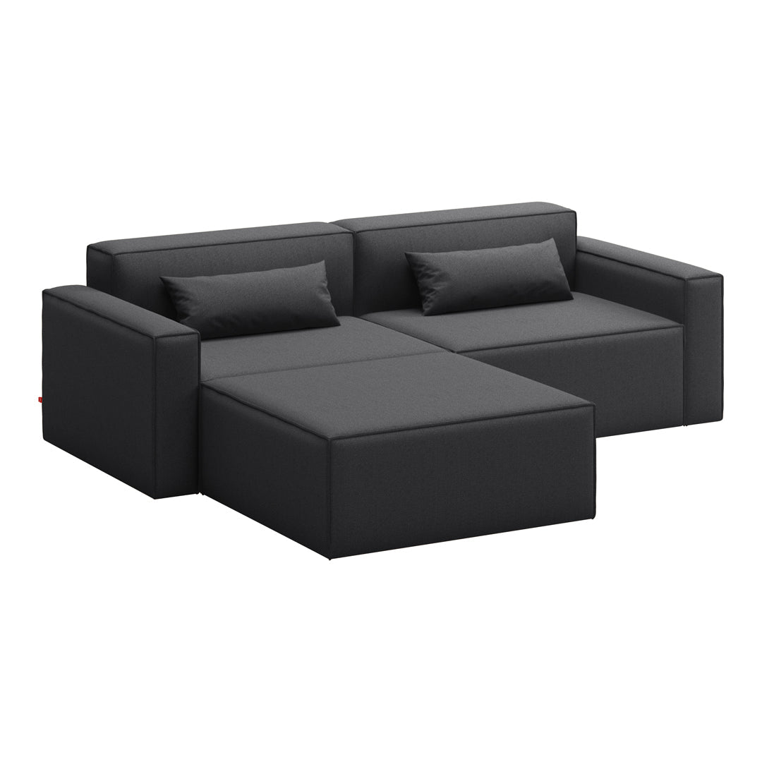 Black upholstered sectional sofa with sleek lines and minimalist design. Ideal for contemporary living spaces.