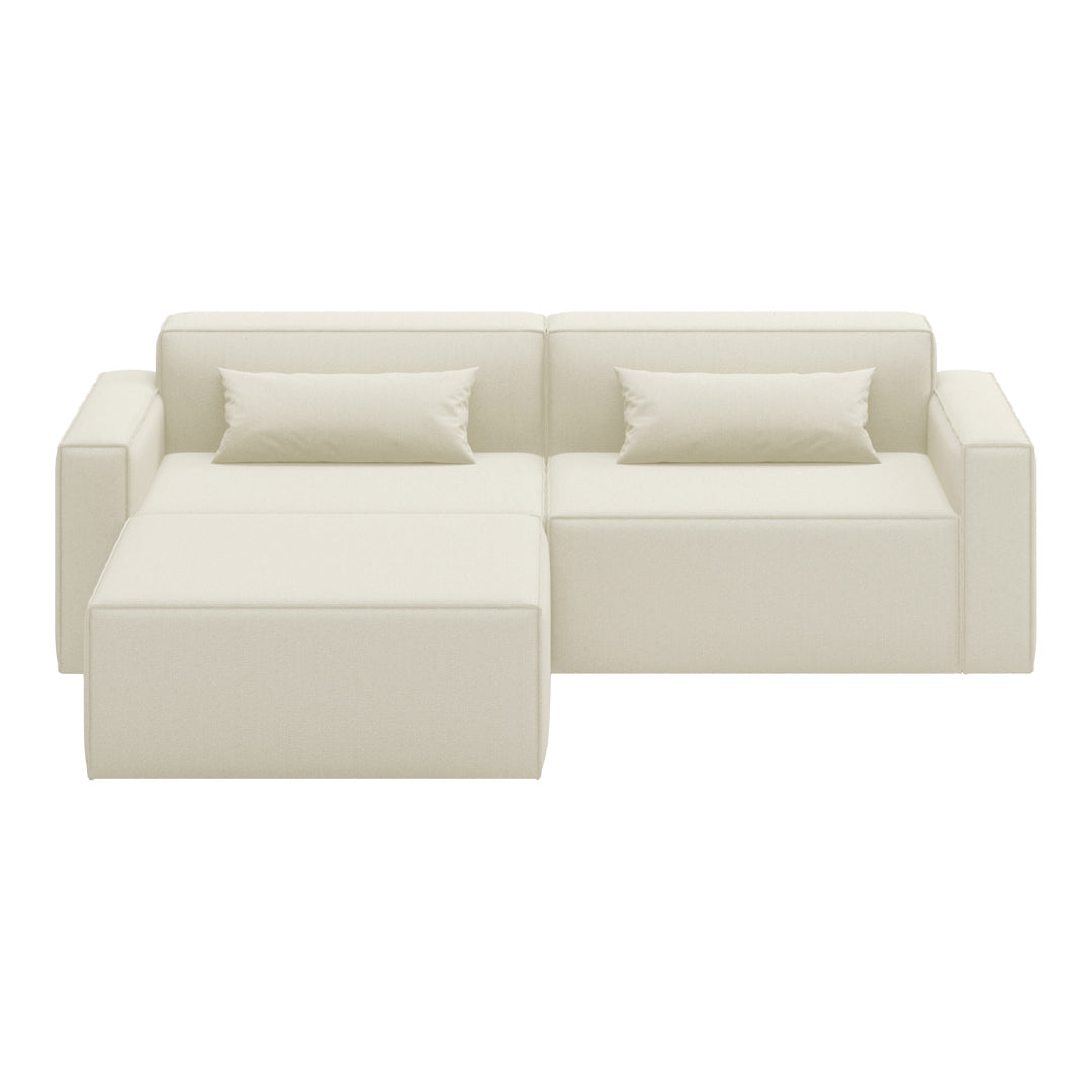 White sectional sofa with smooth, minimalistic cushions and a clean, modern design. Perfect for any decor.