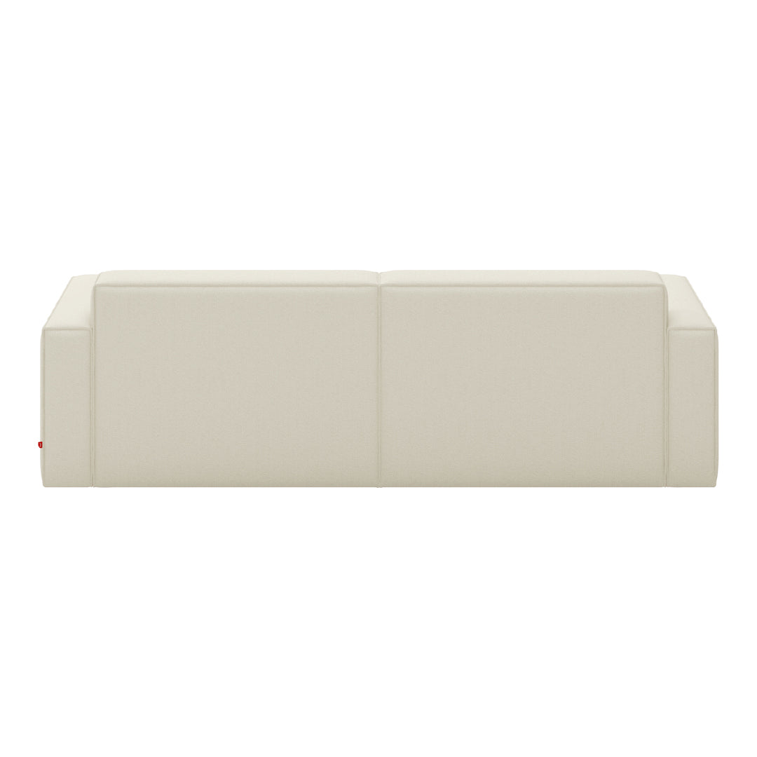 Cream-colored minimalist sofa with smooth, flat surfaces and subtle geometric pattern. Ideal for modern interiors.