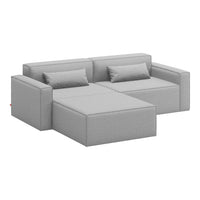 Gray sectional sofa with clean lines and subtle texture, featuring matching cushions for a modern look.