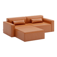 "Modern orange sectional sofa with clean lines and smooth faux leather texture for a stylish living space."