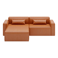 Modern orange sectional sofa with sleek design and two matching accent pillows, featuring a smooth textured finish.