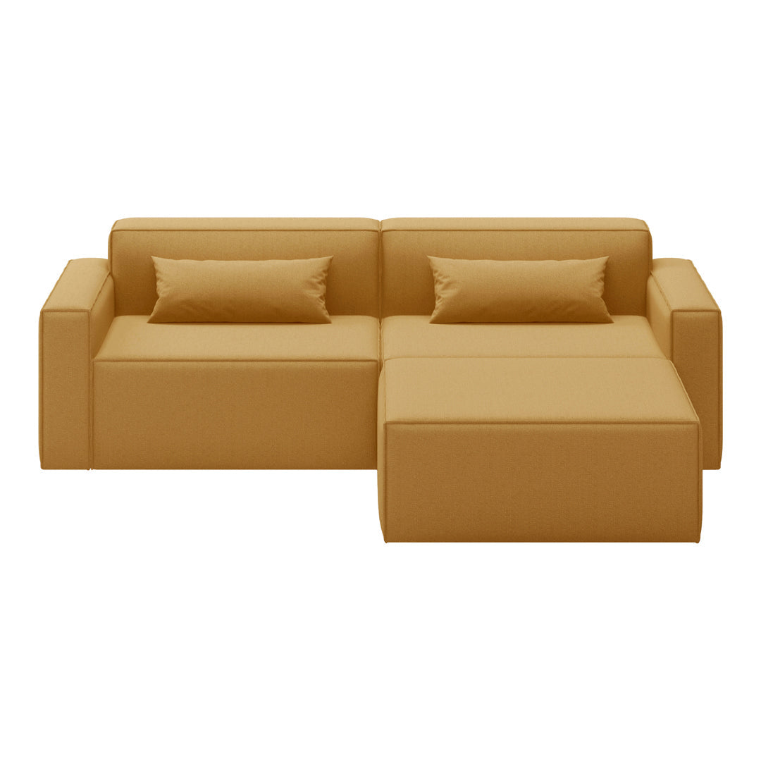 Modern mustard yellow sectional sofa with sleek lines and two matching throw pillows. Perfect for contemporary decor.
