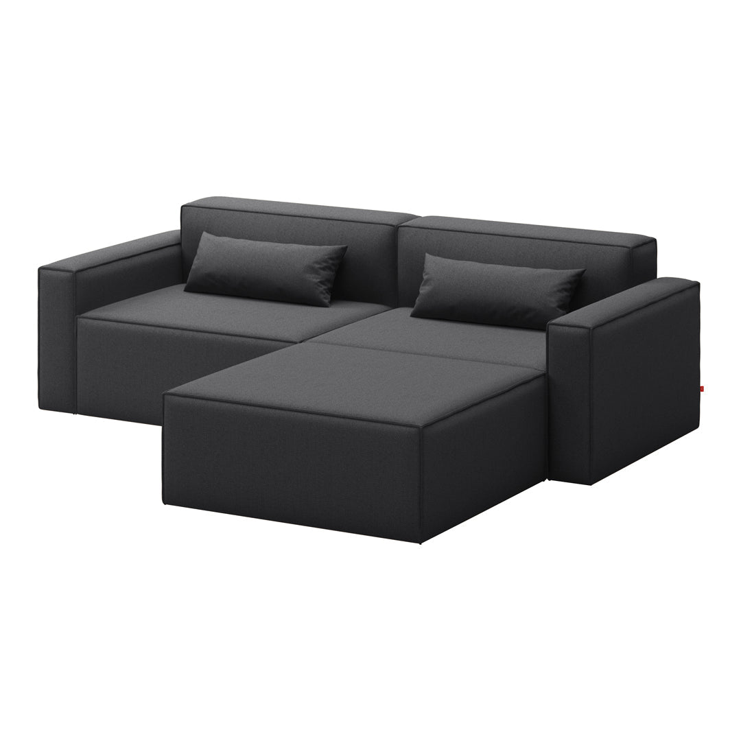 Modern black sectional sofa with clean lines and textured fabric, featuring minimalistic design and matching cushions.