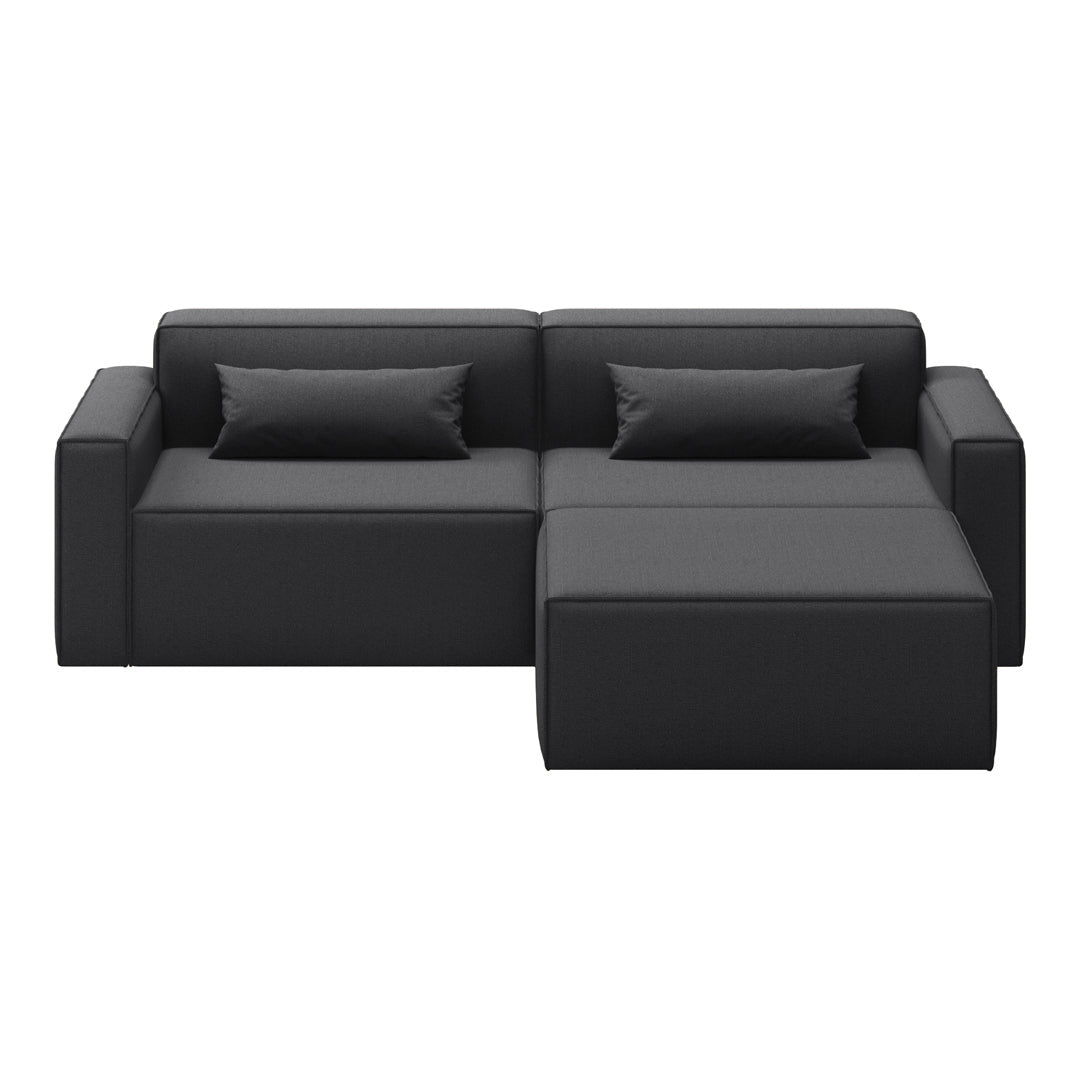 Black contemporary sectional sofa with smooth fabric and simple, clean lines. Includes matching pillows for added comfort.