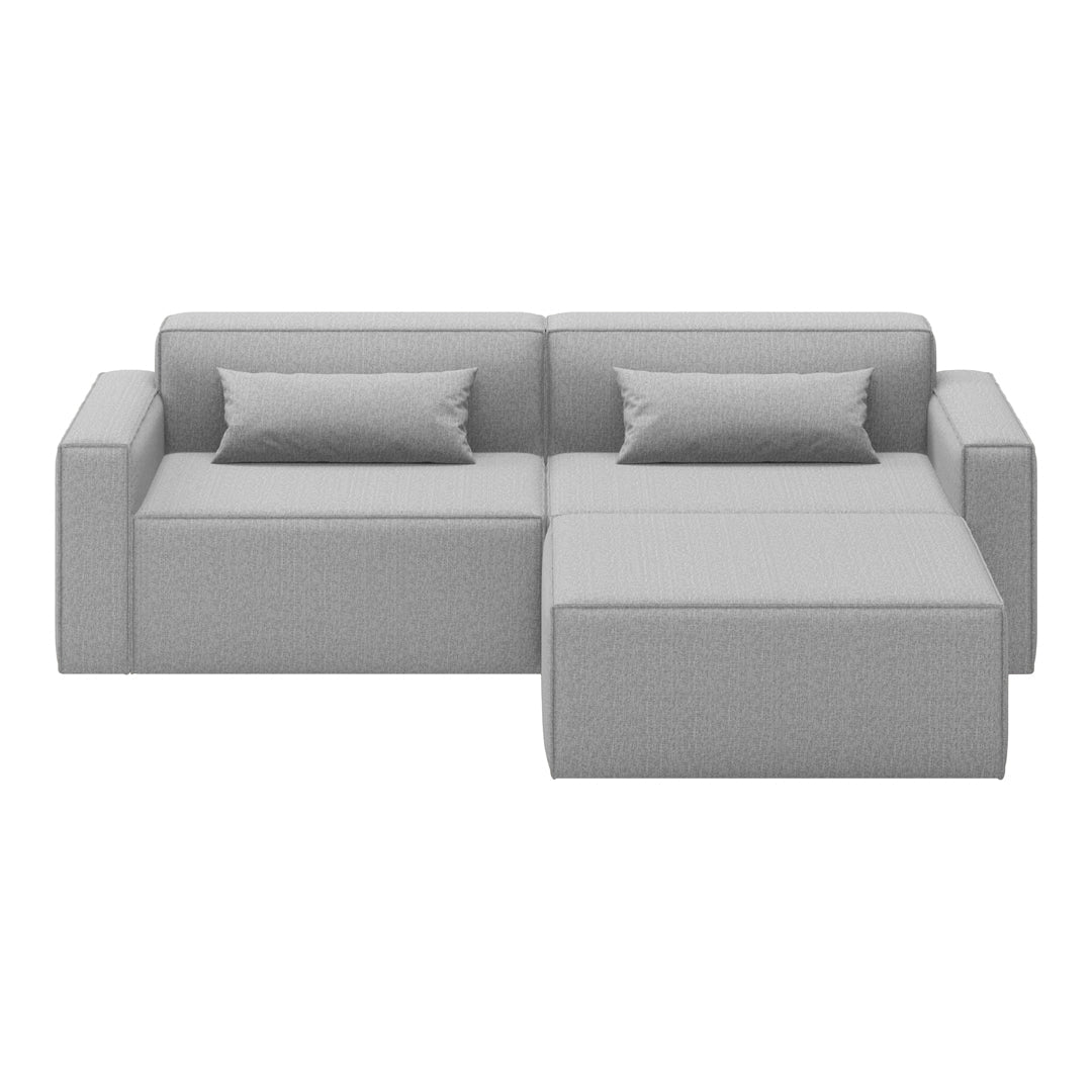 Gray sectional sofa with a modern, minimalist design and subtle textured fabric. Perfect for contemporary interiors.