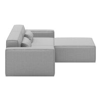Gray sofa with a modern, minimalist design and smooth texture, featuring a solid color and subtle patterns.