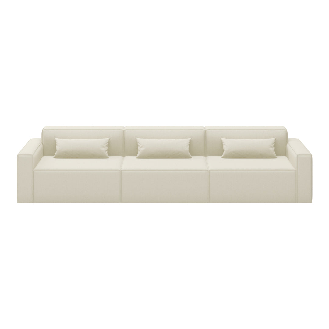 Cream-colored modern sofa with a sleek, minimalist design and three plush, matching throw pillows.