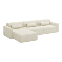 Cream-colored sectional sofa with sleek, modern design and minimalist aesthetic, featuring smooth, monochrome fabric.