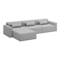 Gray sectional sofa with clean lines and minimalist design, featuring solid fabric and matching cushions.