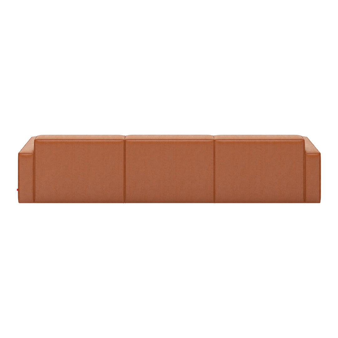 "Solid rust-colored sofa with a sleek, modern design and smooth, textured fabric."