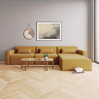 "Modern mustard yellow sectional sofa with minimalist design, paired with a glass coffee table on herringbone wood floor."