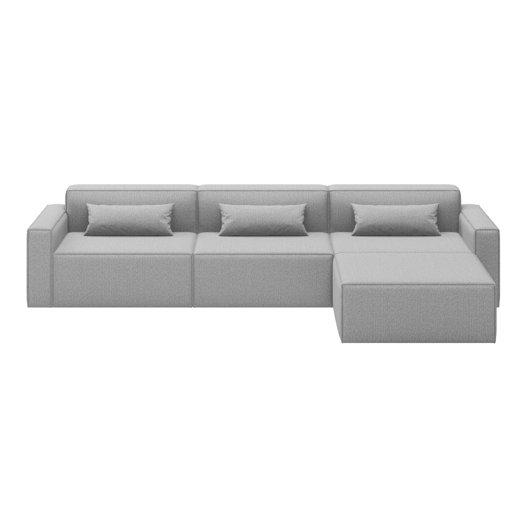 "Modern gray sectional sofa with clean lines and soft fabric, featuring multiple seating sections and matching pillows."