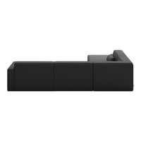 "Sleek black sectional sofa with minimalist design and smooth upholstery."