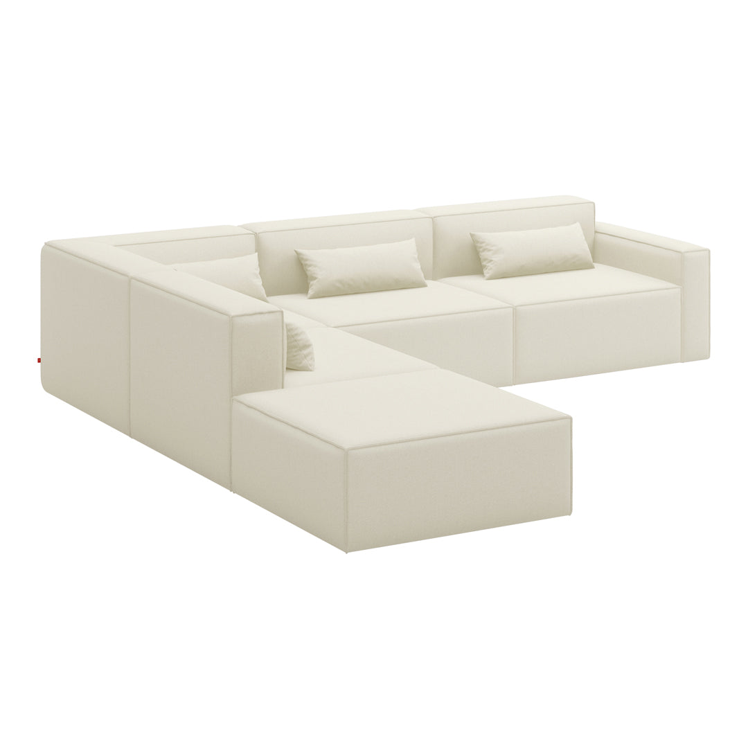 Modern cream sectional sofa with clean lines and minimalist design, featuring a solid, smooth surface.