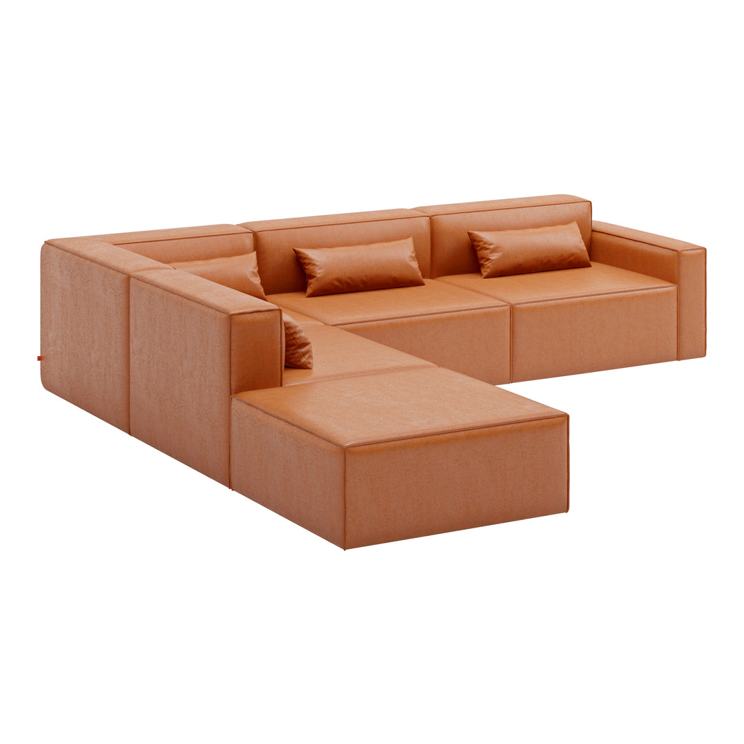 Rust orange modular couch with smooth texture and minimalist design, featuring rectangular cushions and sharp angles.