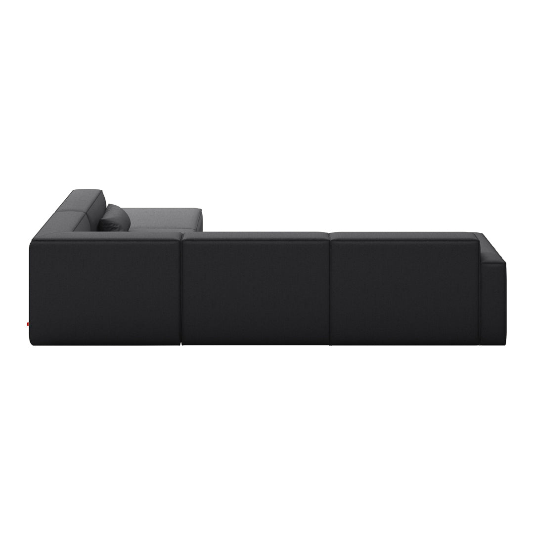 Black minimalist sectional sofa with sleek lines and a smooth, solid fabric pattern. Perfect for modern decor.