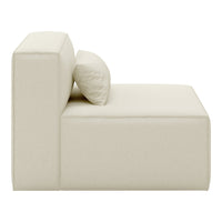 Cream-colored modular sofa with a smooth fabric finish and a round decorative pillow. Modern minimalist design.