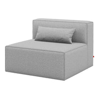 Gray upholstered daybed with a smooth, minimalist design and a matching pillow. Perfect for modern decor.