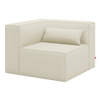 Cream-colored modern corner sofa with a minimalist design and smooth fabric texture, featuring a matching cushion.