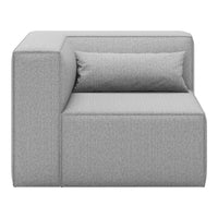 Gray fabric corner sofa with textured pattern and matching accent pillow. Modern minimalist design for stylish interiors.