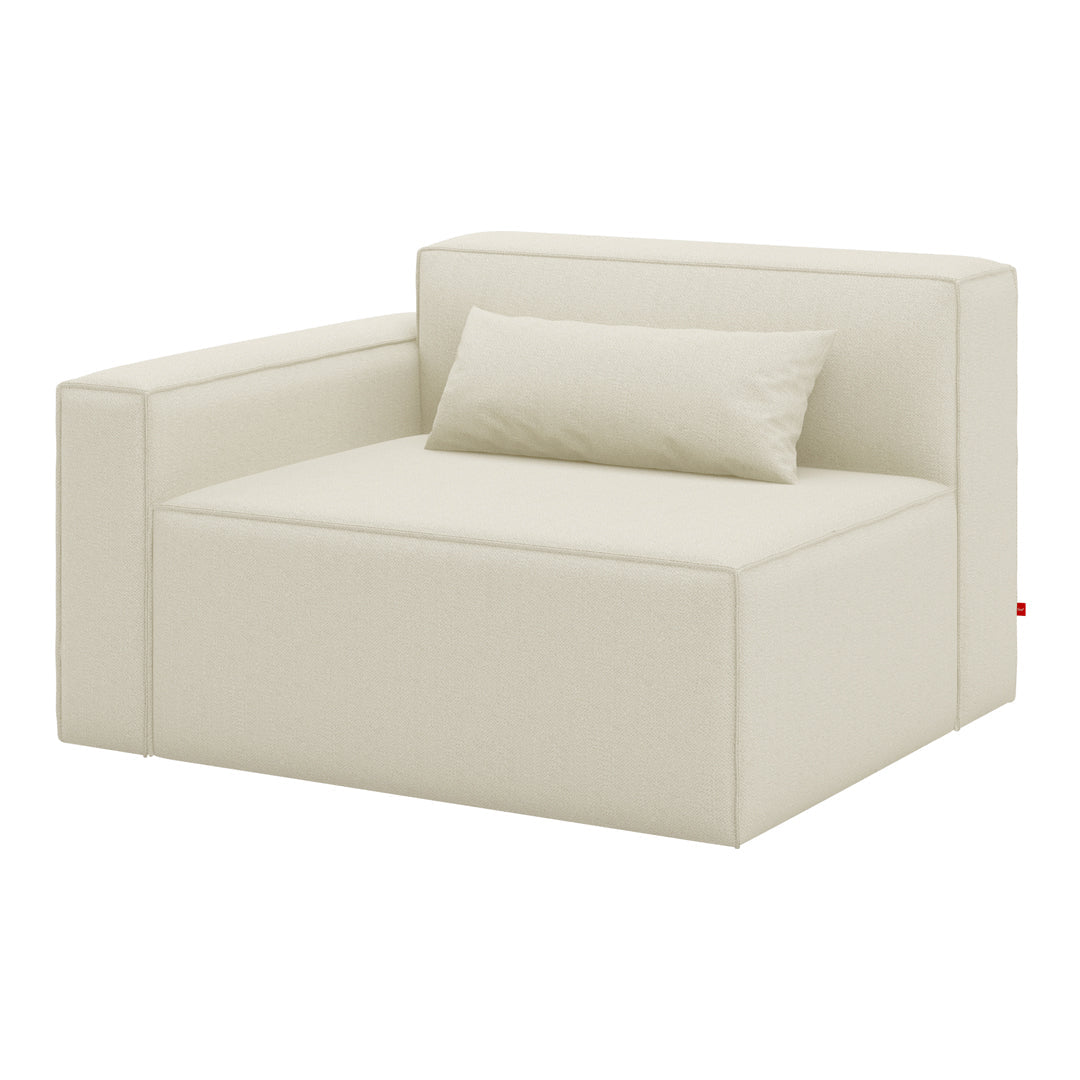 Cream-colored modular sofa with a minimalist design and smooth fabric texture, featuring a matching lumbar pillow.