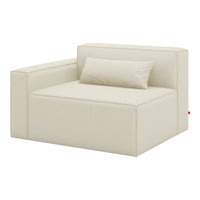 Cream-colored modular sofa with a minimalist design and smooth fabric texture, featuring a matching lumbar pillow.