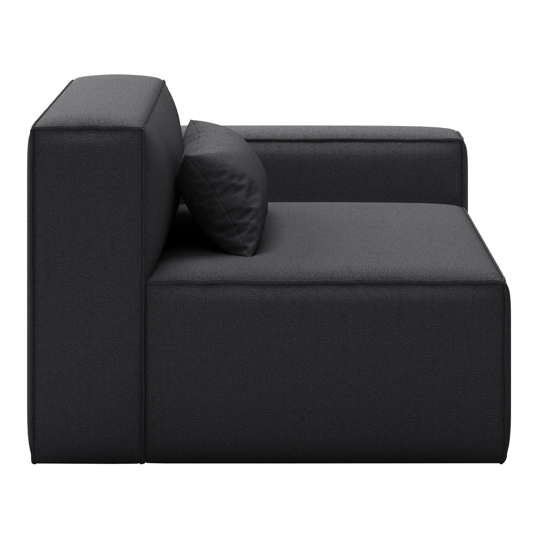 Black modular sofa with a smooth texture and minimalistic design, featuring a single accent cushion.