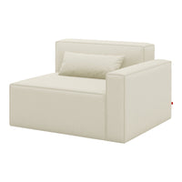 Beige modular armchair with smooth, minimalist design and a matching cushion for a modern aesthetic.