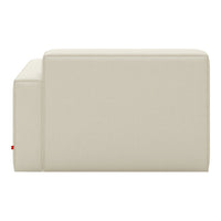 Beige upholstered couch with a smooth, minimalist design, perfect for modern living spaces.
