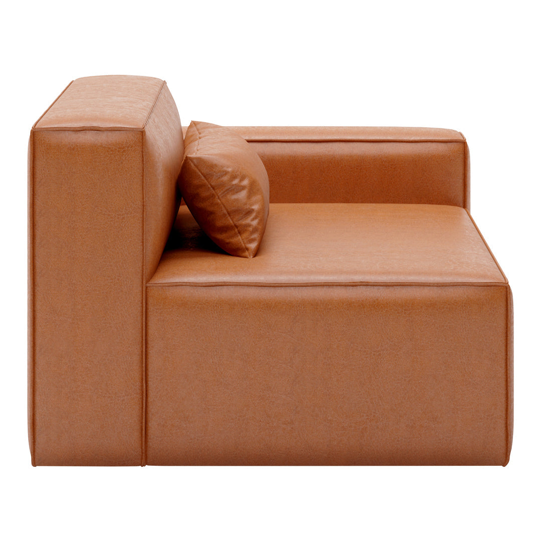 Tan leather sectional sofa with a sleek, minimalist design and a matching decorative pillow.