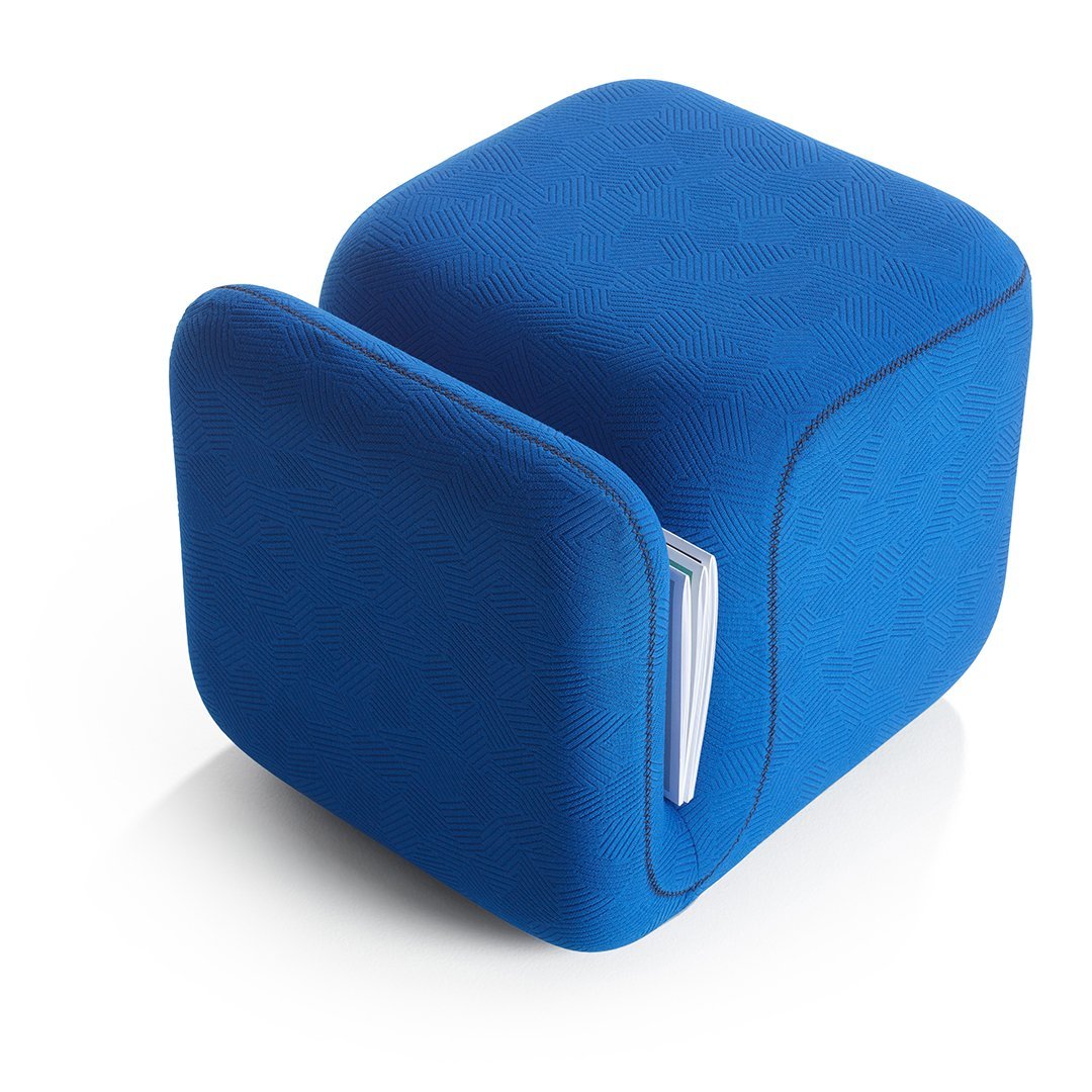 Vibrant blue cube ottoman with a sleek, smooth texture and subtle color variations for a modern touch.
