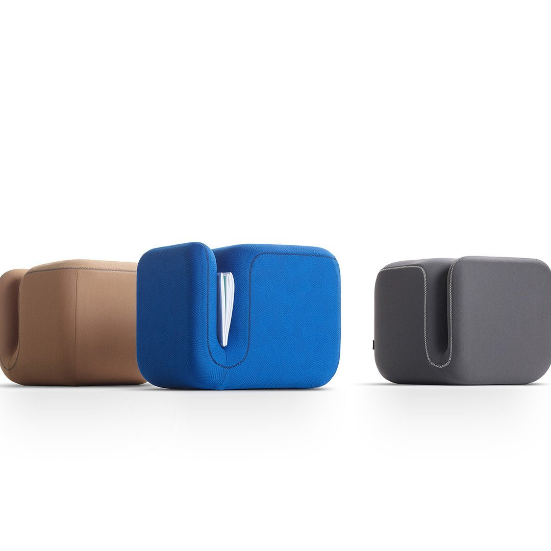 Three modern tissue box covers in beige, blue, and dark gray with sleek, minimalist designs.