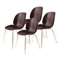 Set of four sleek brown plastic chairs with gold metal legs, featuring a smooth, minimalist design.