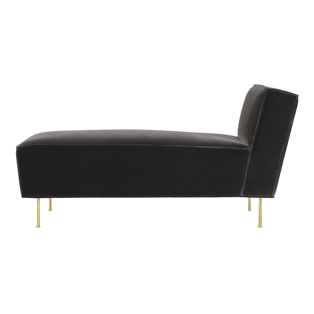 Black velvet chaise lounge with sleek gold legs, featuring a minimalist design and smooth texture for a modern aesthetic.