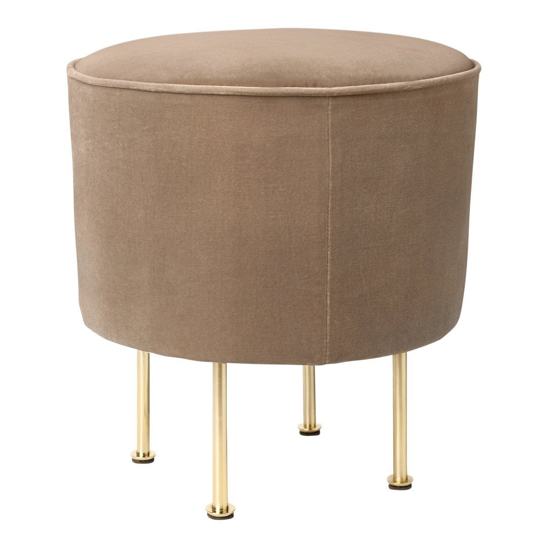 Round beige velvet stool with gold legs, featuring a smooth texture and minimalist design.