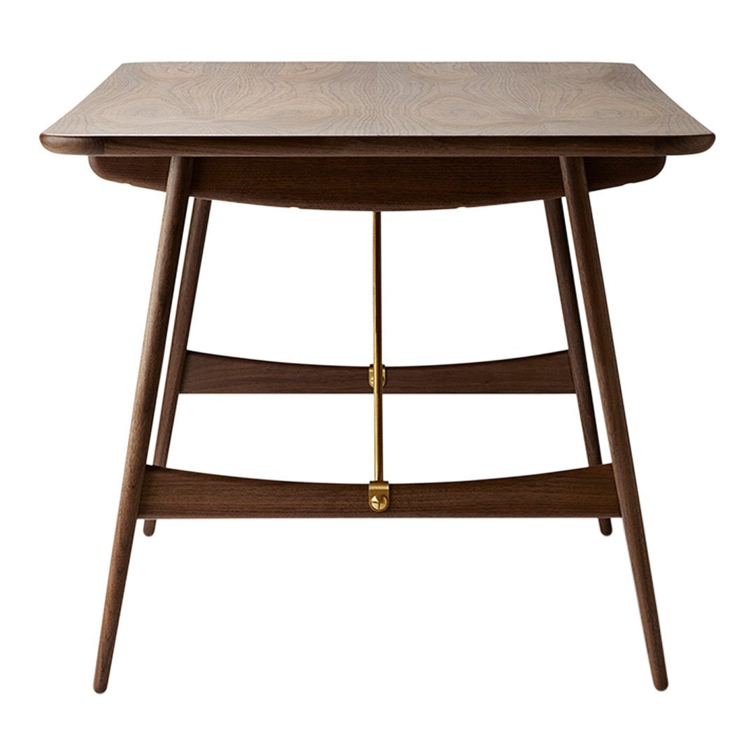 Mid-century modern table in rich walnut finish with sleek lines and minimalistic design. Perfect for contemporary decor.